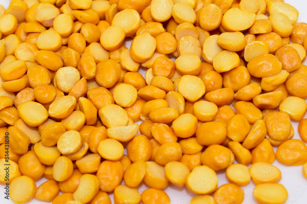 Close-up of Organic Gram (Cicer arietinum) or split yellow chana dal background. Close-up of Organic Gram (Cicer arietinum) or split yellow chana dal background.
