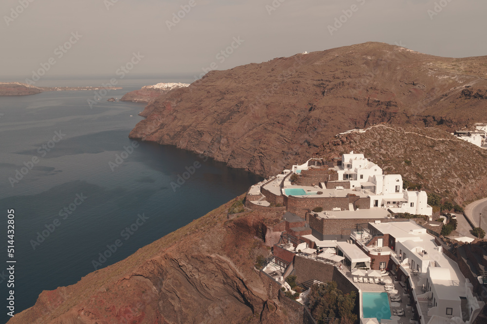 View from Imerovigli in Santorini Greece, May 2022. Retro style and colour graded image. View across aegean sea towards famous town of Oia on north of Greek Island