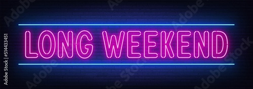 Long weekend neon sign on brick wall background.