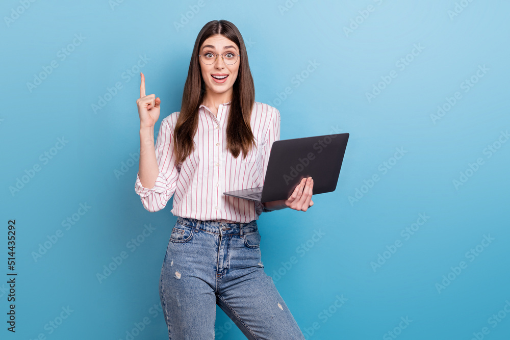 Photo of cute smart lady dressed pink shirt glasses communicating modern gadget empty space isolated blue color background Photo of cute smart lady dressed pink shirt glasses communicating modern gadget empty space isolated blue color background