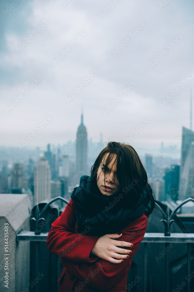 the girl looks at the city from a height
the girl looks at the city from a height