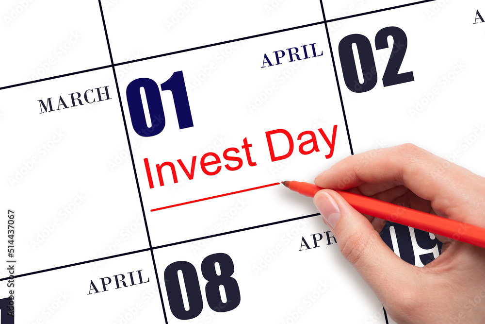 Hand drawing red line and writing the text Invest Day on calendar date April 1. Business and financial concept. Hand drawing red line and writing the text Invest Day on calendar date April 1. Business and financial concept.