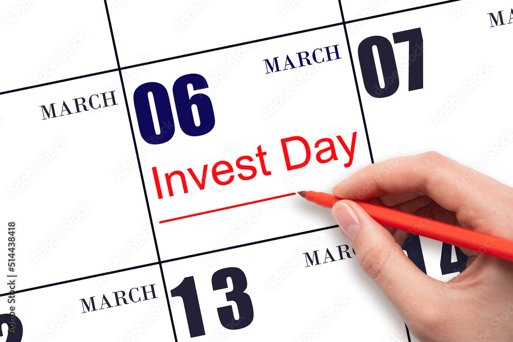 Hand drawing red line and writing the text Invest Day on calendar date March 6. Business and financial concept. Hand drawing red line and writing the text Invest Day on calendar date March 6. Business and financial concept.