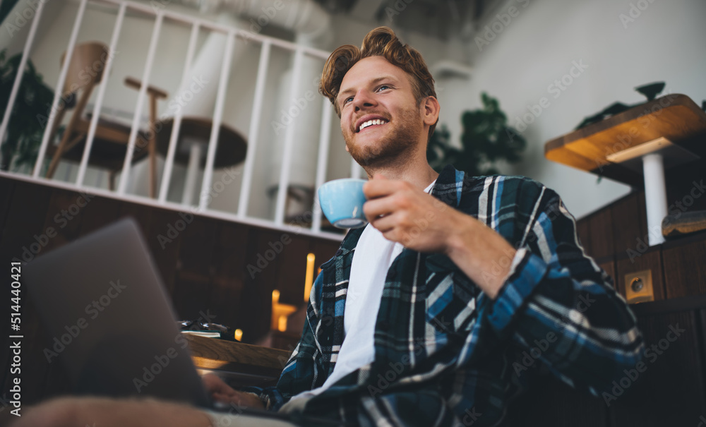 Guy using laptop in coworking office space