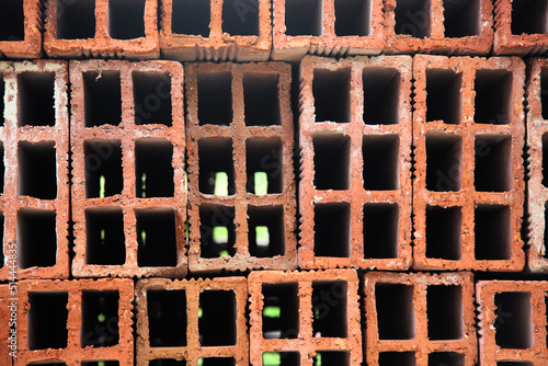 Фотография Pile of hollow bricks for constructing a building - close up