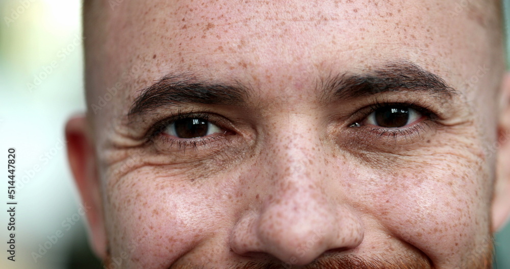 Obraz premium Contemplative young man closing eyes, taking a deep breath, feeling relaxed. close-up eyes portrait face