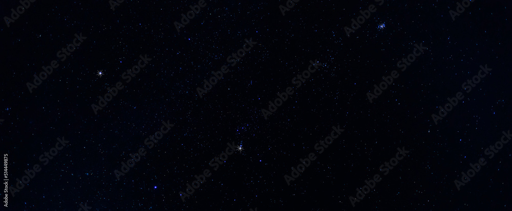 Stars in the sky.
Blue night panorama, milky way sky and stars on dark background, universe full of stars, nebula and galaxies.