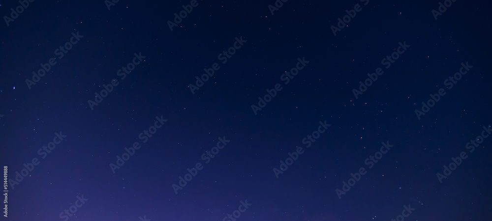 Fototapeta premium Stars in the sky. Blue night panorama, milky way sky and stars on dark background, universe full of stars, nebula and galaxies.
