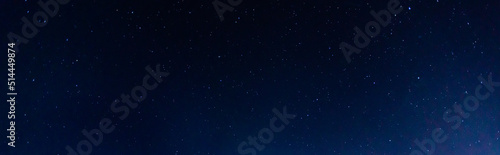 Panorama blue night sky milky way and star on dark background.Universe filled with stars, nebula and galaxy with noise and grain.Photo by long exposure and select white balance.selection focus.amazing