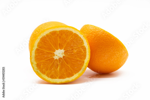 fresh whole and slices orange isolated on white background.