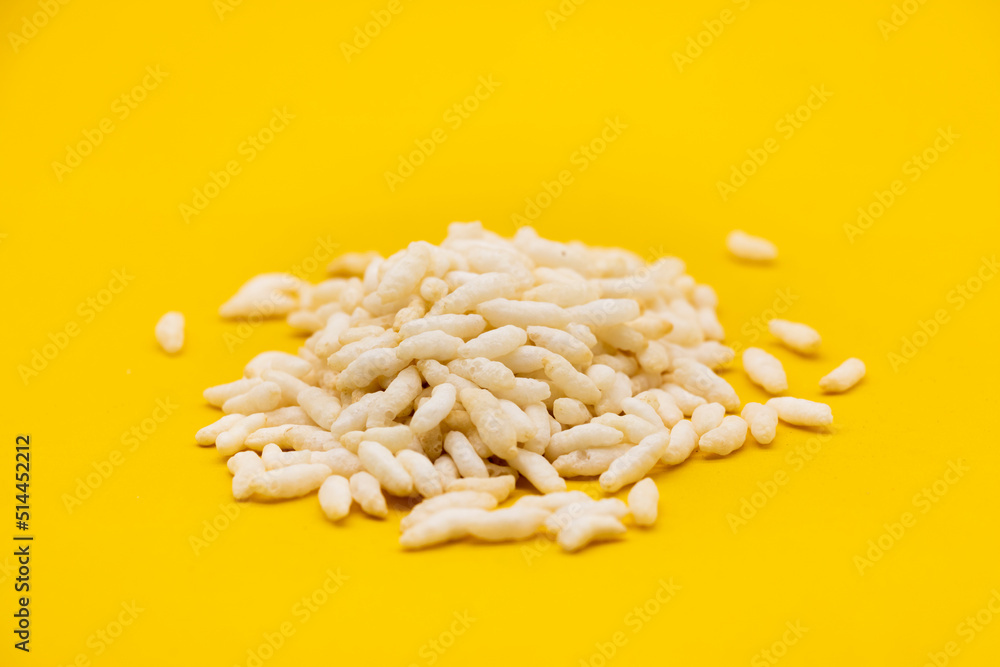 Puffed rice, Churmure or murmure or moori isolated on yellow background.