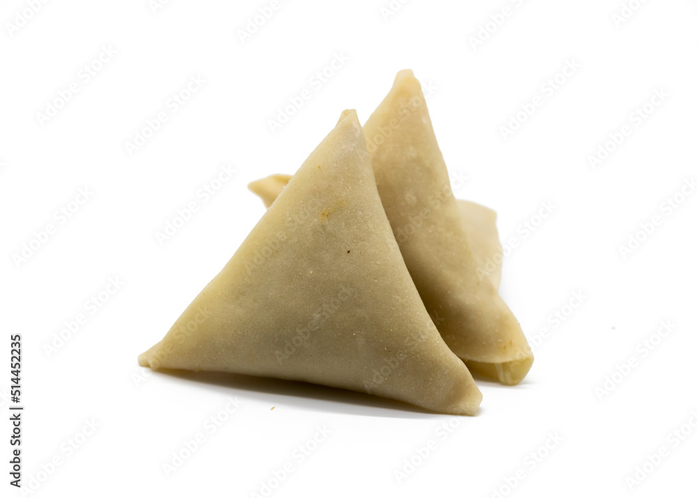 Samosas or samosas with meat and vegetables isolated on white background.
