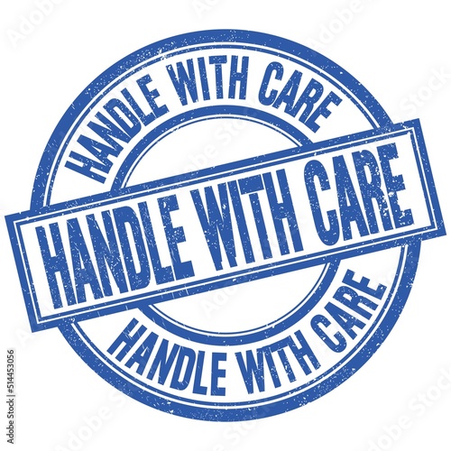 HANDLE WITH CARE written word on blue stamp sign