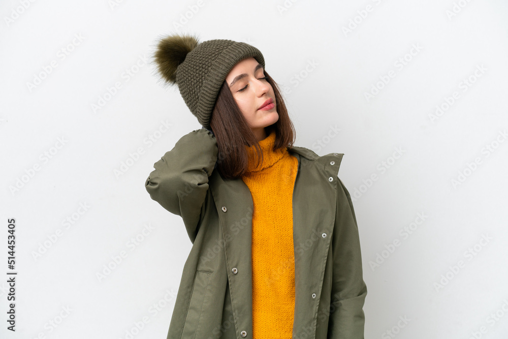 Young Ukrainian woman wearing winter jacket isolated on white background with neckache Young Ukrainian woman wearing winter jacket isolated on white background with neckache