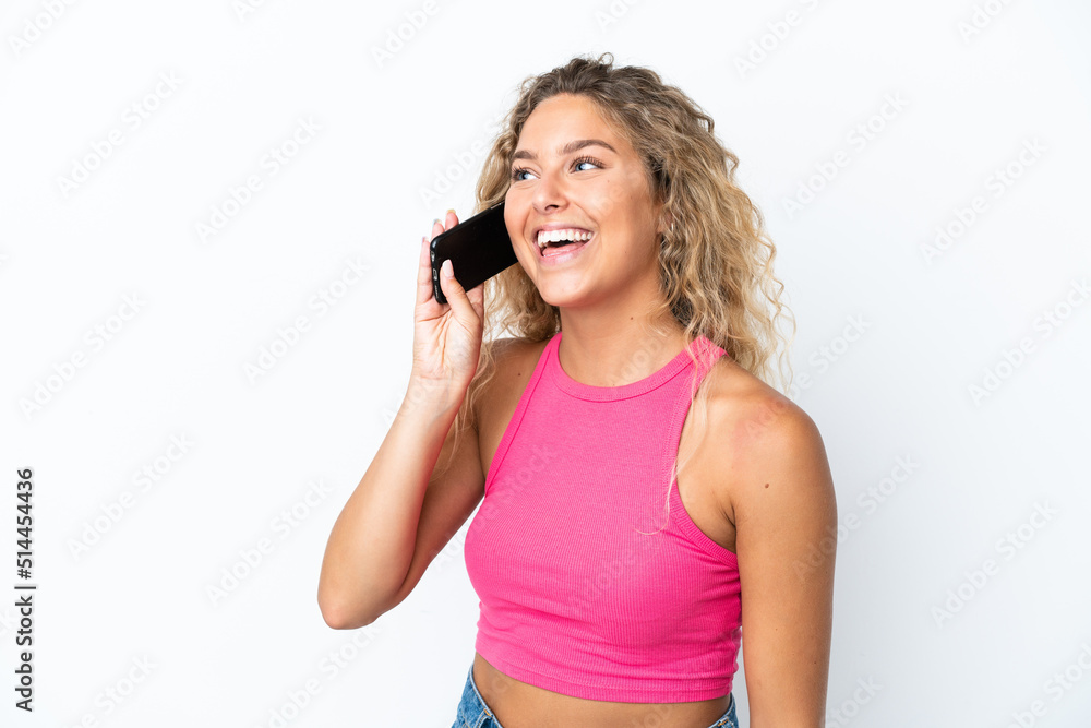 Girl with curly hair isolated on white background keeping a conversation with the mobile phone Girl with curly hair isolated on white background keeping a conversation with the mobile phone