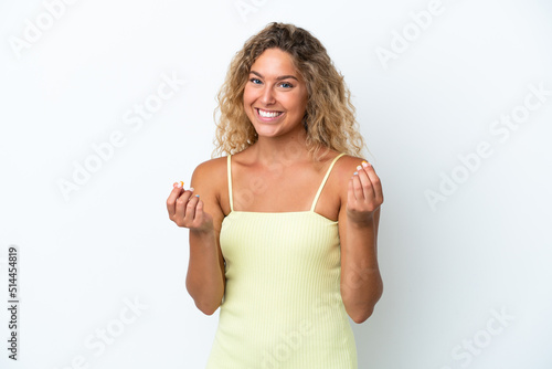 Girl with curly hair isolated on white background making money gesture