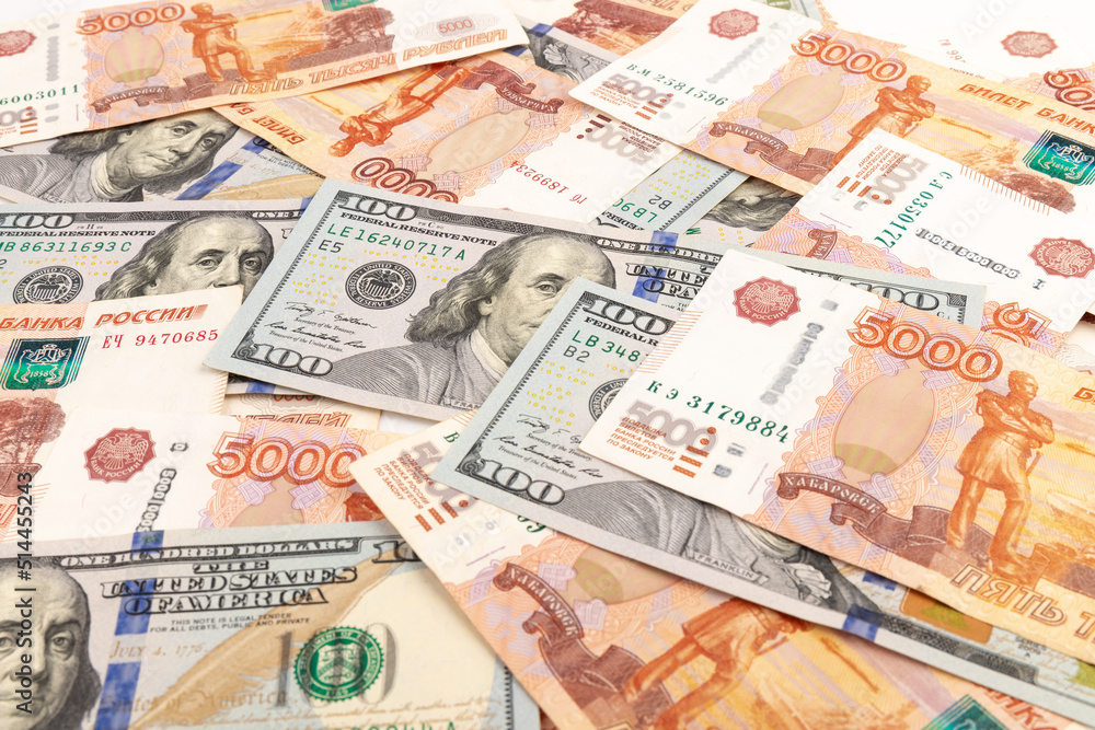 US Dollar and Russian ruble. Money background. Currency exhange. Economic crisis. Rouble dollar cash. Hundred dollar bill and 5000 rubles. Business and finance. Russia and USA US Dollar and Russian ruble. Money background. Currency exhange. Economic crisis. Rouble dollar cash. Hundred dollar bill and 5000 rubles. Business and finance. Russia and USA