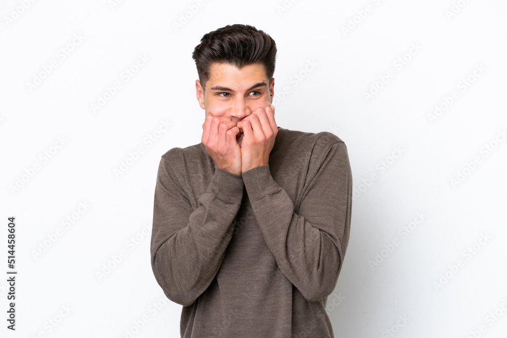 Young handsome caucasian man isolated on white bakcground nervous and scared putting hands to mouth Young handsome caucasian man isolated on white bakcground nervous and scared putting hands to mouth