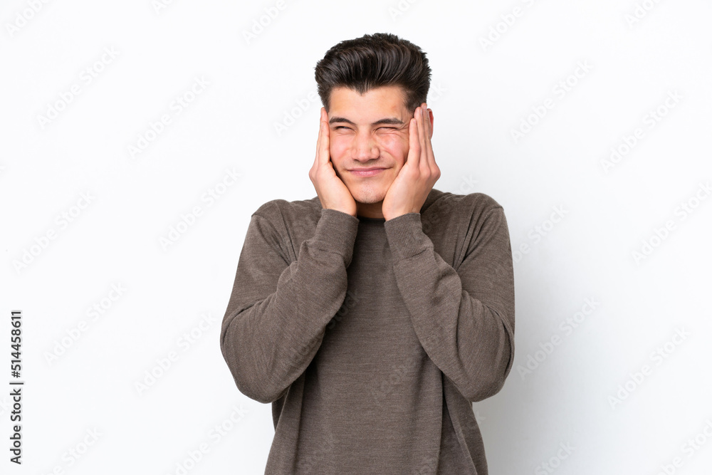 Young handsome caucasian man isolated on white bakcground frustrated and covering ears Young handsome caucasian man isolated on white bakcground frustrated and covering ears