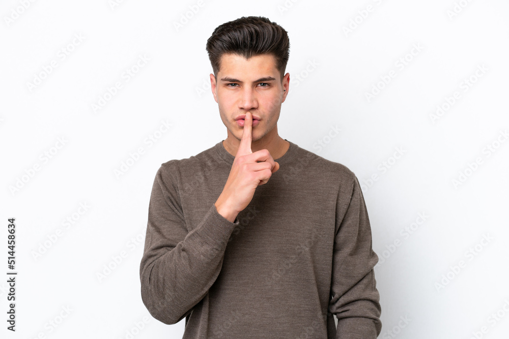 Young handsome caucasian man isolated on white bakcground showing a sign of silence gesture putting finger in mouth Young handsome caucasian man isolated on white bakcground showing a sign of silence gesture putting finger in mouth