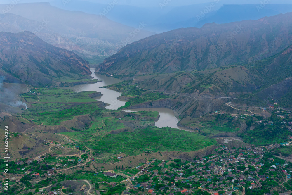 foggy mountain valley with river, villages and fields foggy mountain valley with river, villages and fields