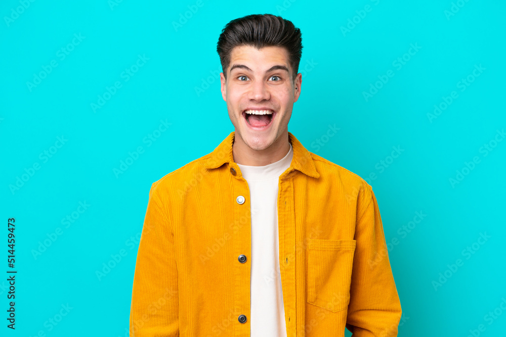 Young handsome caucasian man isolated on blue bakcground with surprise facial expression Young handsome caucasian man isolated on blue bakcground with surprise facial expression
