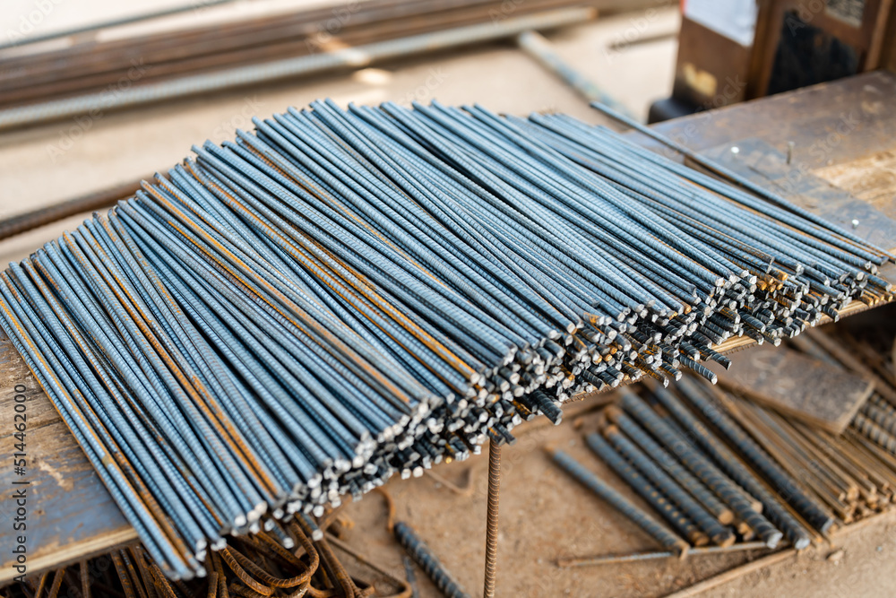 A large number of rebars were cut into pieces to prepare for use in the construction of buildings piled up at the construction site. A large number of rebars were cut into pieces to prepare for use in the construction of buildings piled up at the construction site.
