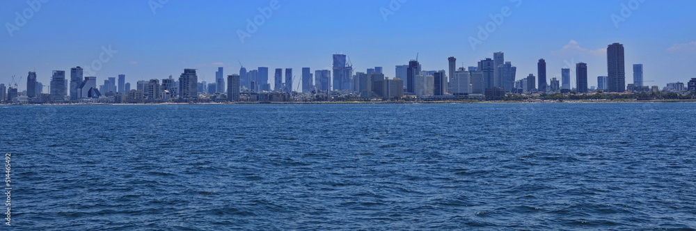 Panorama of Tel Aviv. View from the sea. Mediterranean sea and skyscrapers. Modern city, high-rise buildings, metropolis on the coast