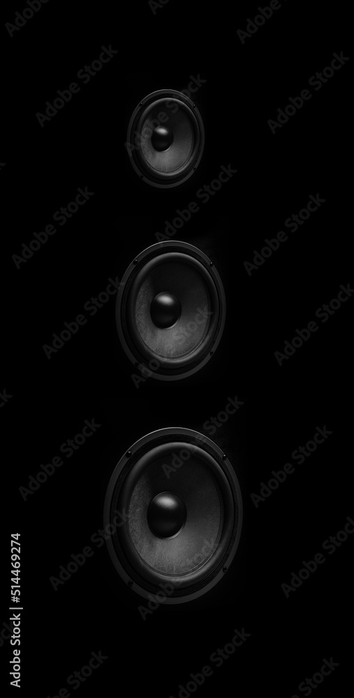 Beautiful powerful sound speaker close-up on a dark background. Beautiful powerful sound speaker close-up on a dark background.