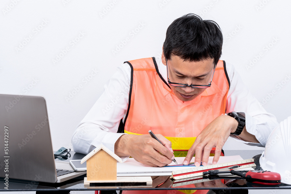 Asian man engineer Sitting at a glass table, drqwing a sketvh of the project, On white background, to people employee and engineer concept. Asian man engineer Sitting at a glass table, drqwing a sketvh of the project, On white background, to people employee and engineer concept.