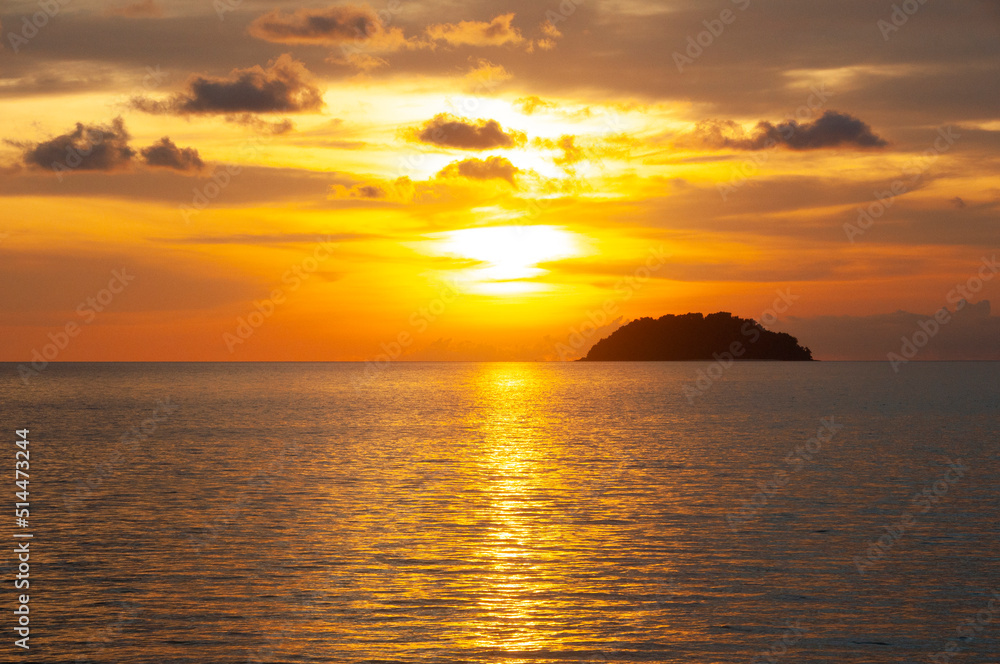 Colorful beach sunset view with island background. Copy space