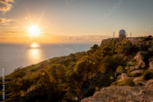 Sunset over Dingli Cliffs, Malta. Radar visible in the background. Photo taken in January 2022.