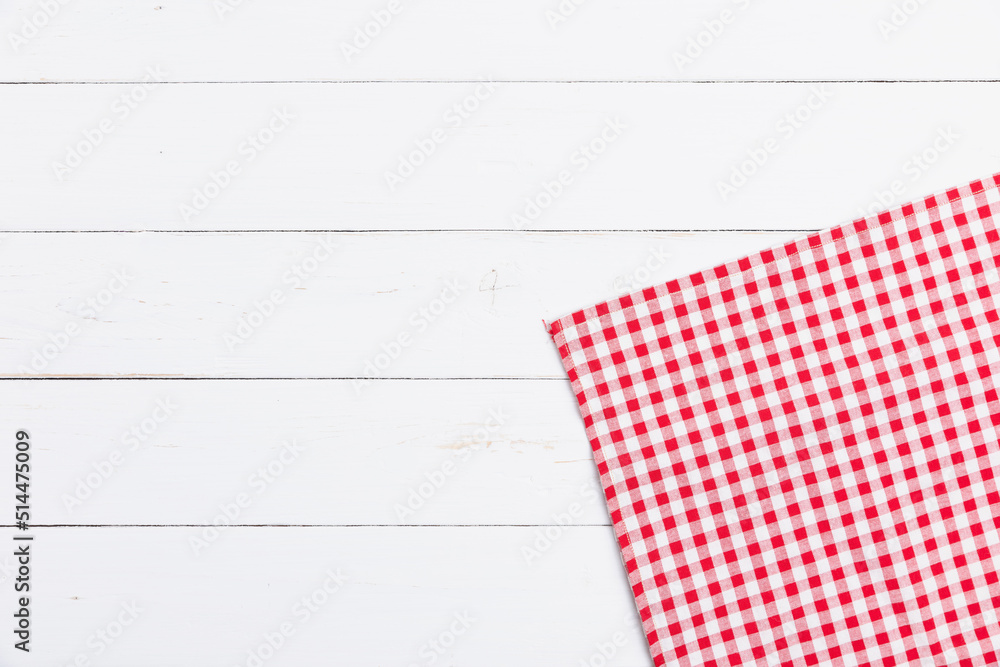 Flat lay cotton with copy space for text menu to restaurants. Top view of fabric tablecloth red and white checkered on wooden white table. Flat lay cotton with copy space for text menu to restaurants. Top view of fabric tablecloth red and white checkered on wooden white table.