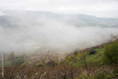 View of a beautiful foggy valley