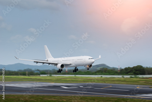 blur withe airplane landing on runway 