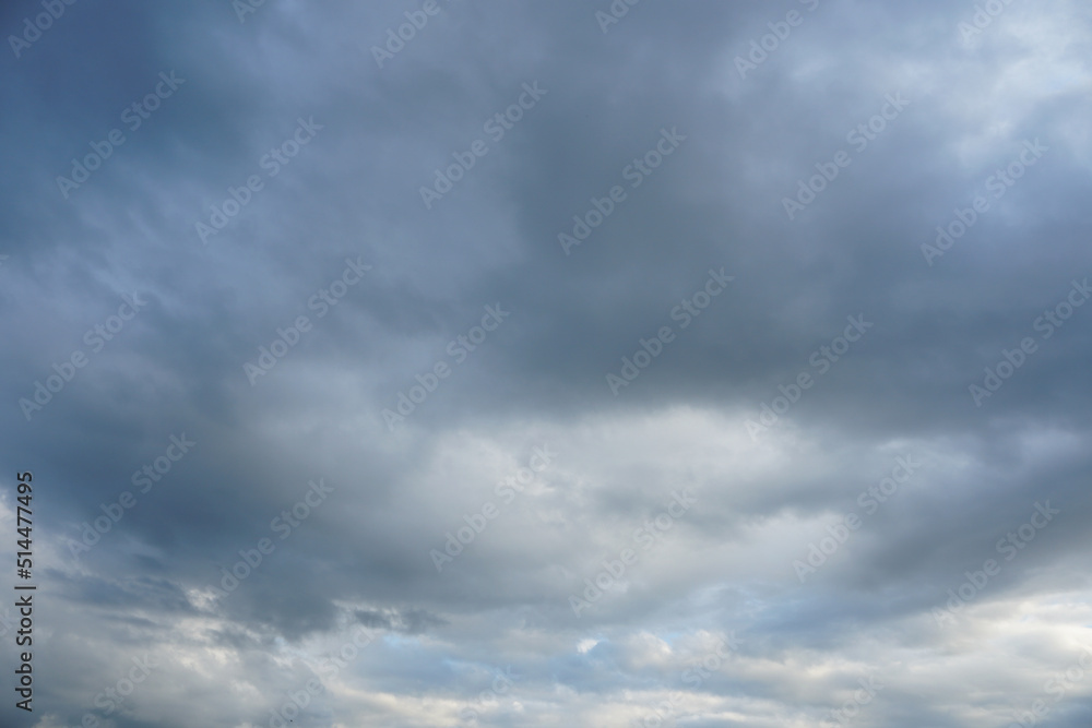 Dark and grey featureless layers of nimbostratus clouds.