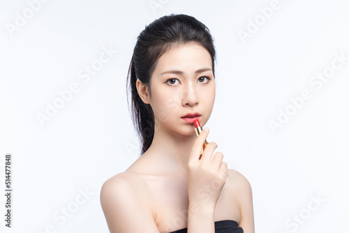 Asian beauty doing makeup