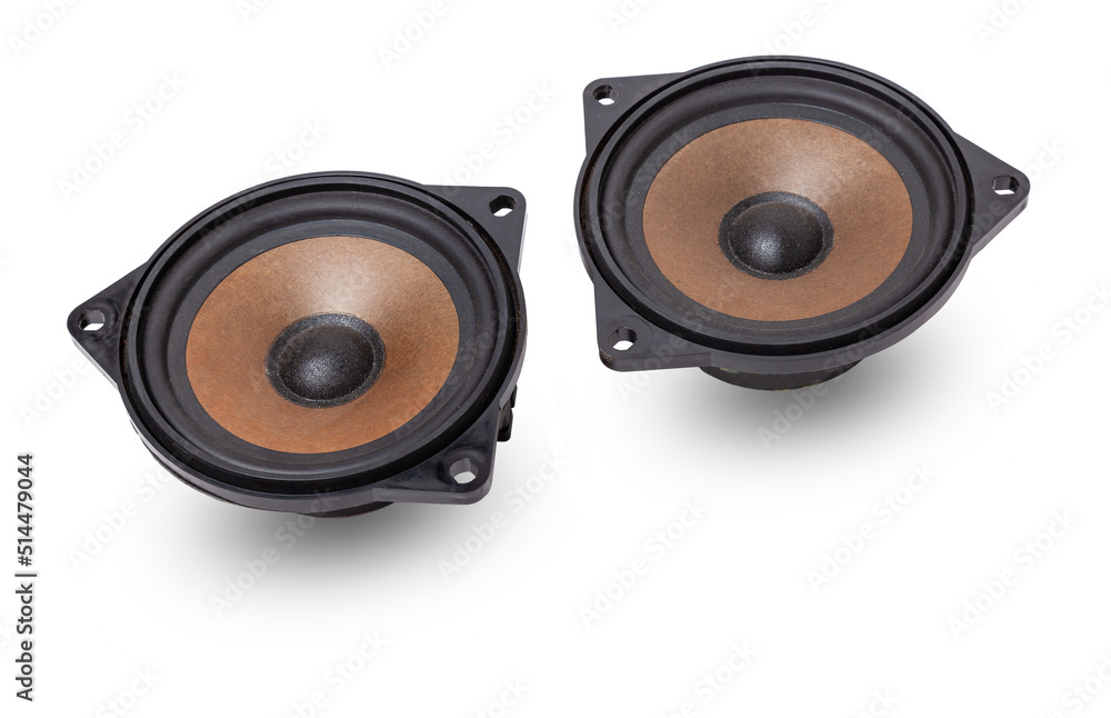 Two speakers of an acoustic system - an audio for playing music in a car interior on a white isolated background in a photo studio. Spare parts for auto repair in a workshop or for sale for tuning. Two speakers of an acoustic system - an audio for playing music in a car interior on a white isolated background in a photo studio. Spare parts for auto repair in a workshop or for sale for tuning.