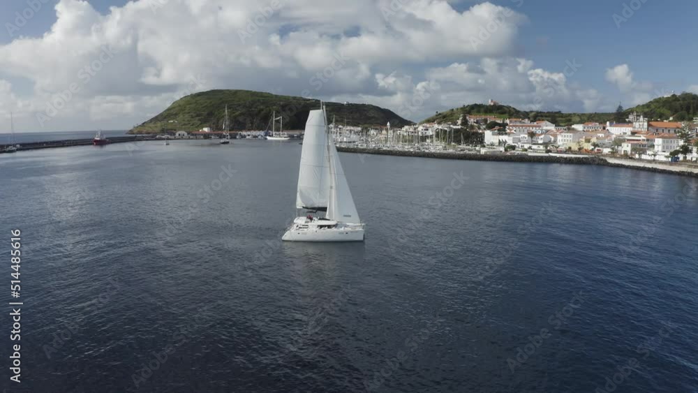 Aerial View of Sailboat while sailing in a regatta off the coast of Matriz, Azores, Portugal. Aerial View of Sailboat while sailing in a regatta off the coast of Matriz, Azores, Portugal.