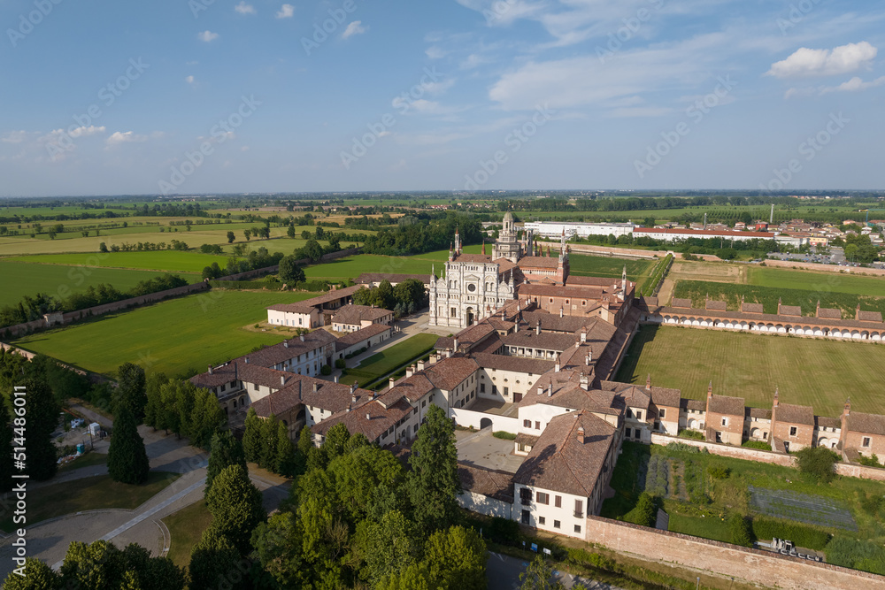 Aerial view of the Certosa di Pavia at sunny day, built in the late fourteenth century, courts and the cloister of the monastery and shrine in the province of Pavia, Lombardia, Italy