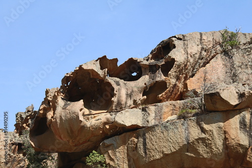 Alien looking rock formation, large round gapping holes, granite rock  Corsica, France