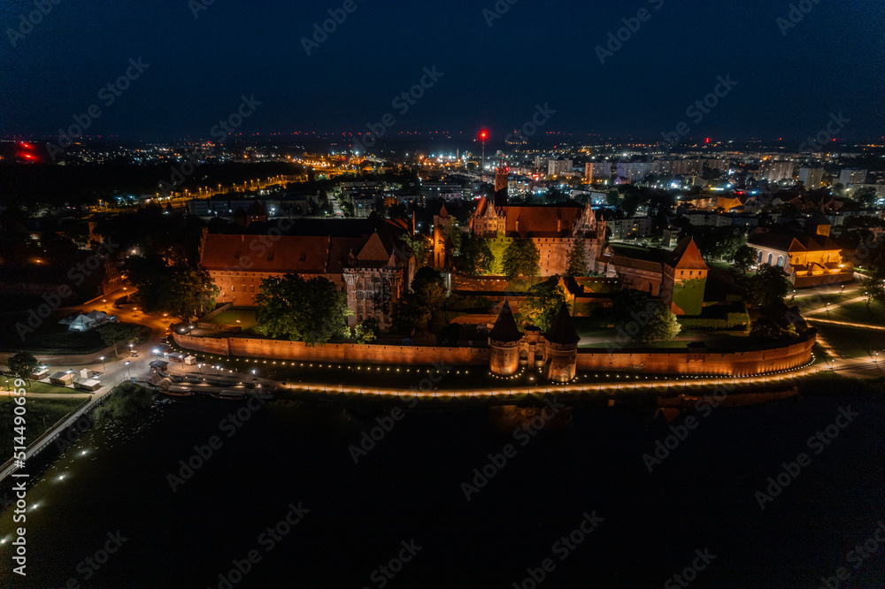 Night panorama of the castle in Malbork from a height