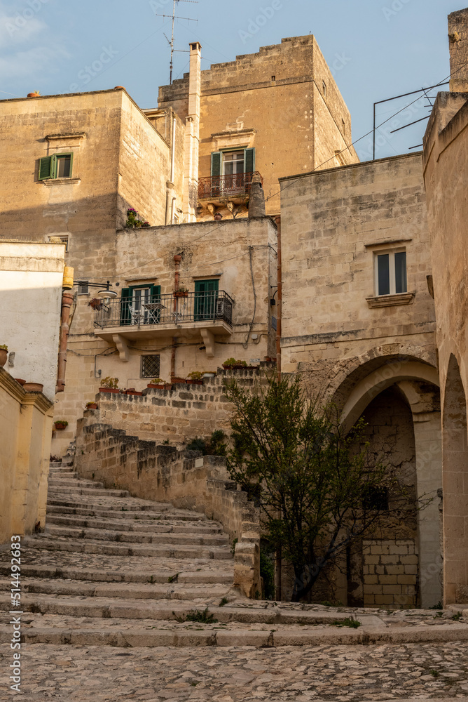 Abandoned alley with staircase in the historic downtown of Matera, Southern Italy