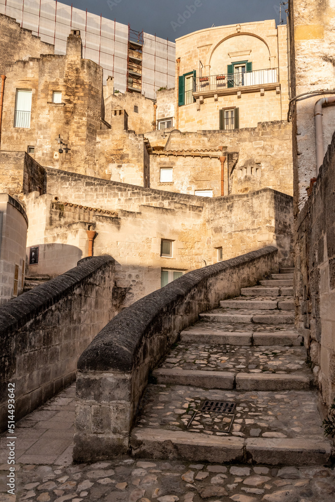 Abandoned alley with staircase in the historic downtown of Matera, Southern Italy