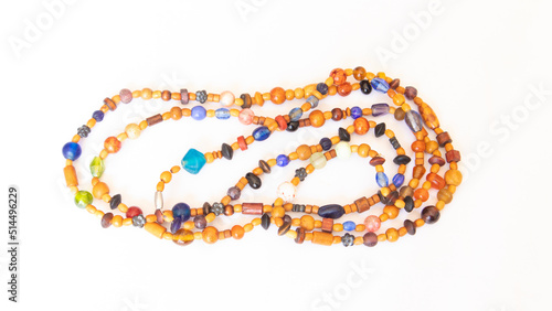 colorful wooden bead necklace white background