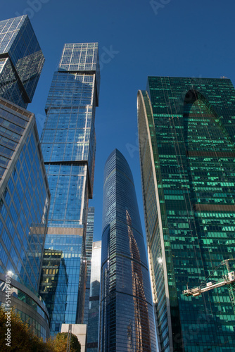 Skyscrapers of the  International Business Center Moscow City reflecting the sun on a autumn day against the blue sky