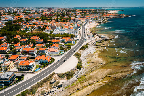 Aerial drone view of Marginal Avenue and coastline with Parade district in Greater Lisbon, Portugal photo