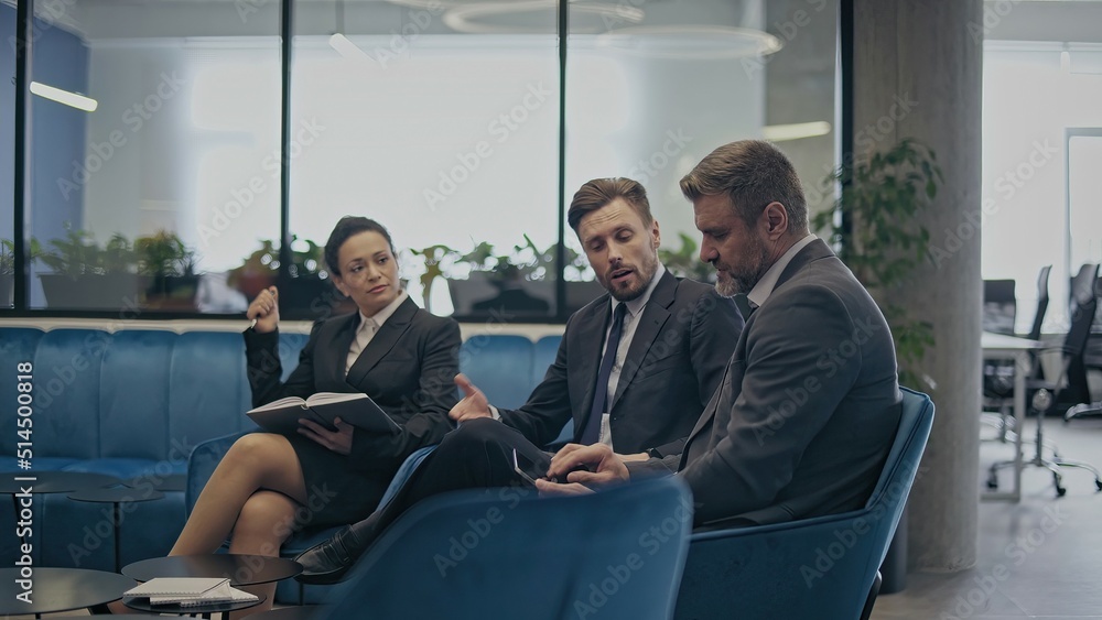 Male and female colleagues brainstorming, sitting in office room, planning a project Male and female colleagues brainstorming, sitting in office room, planning a project