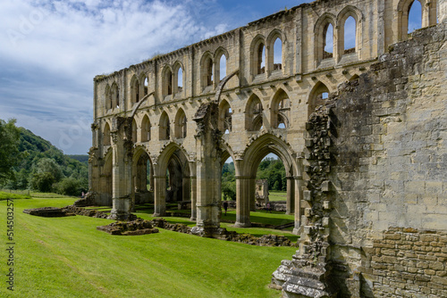 view of the nave and church ruins in the historic Rievaulx Abbey in North Yorkshire