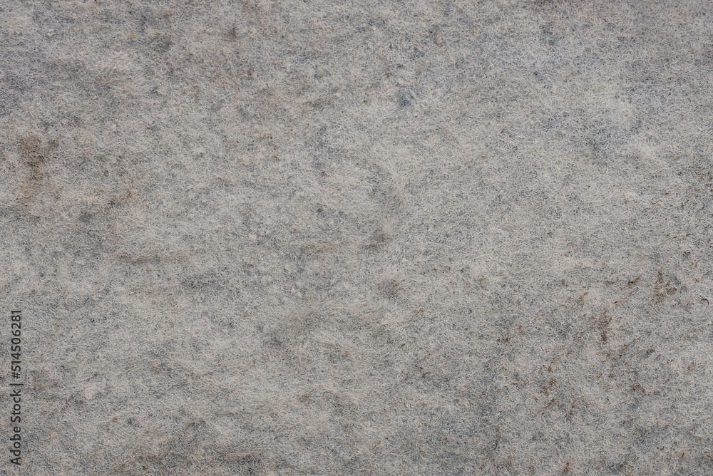 gray white fabric texture of woolen dirty upholstery on the wall